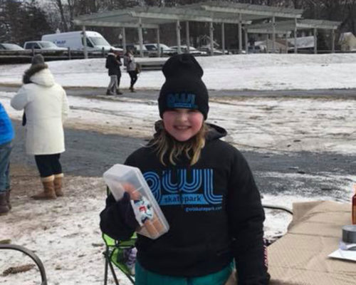 Jessica Bell raising over $200 for the GWL Skatepark Corp by selling hand-warmers at the Winter Classic ice-hockey tournament